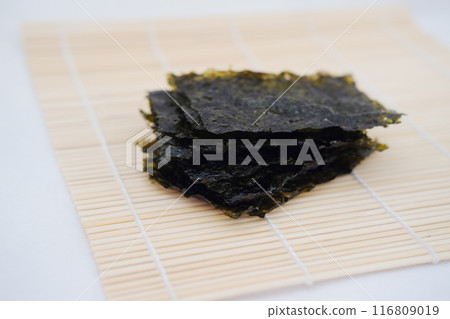 Dried seaweed on a bamboo. Japanese food Dried seaweed on a bamboo. Japanese food 116809019
