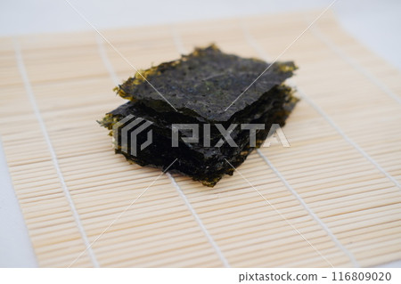 Dried seaweed on a bamboo. Japanese food Dried seaweed on a bamboo. Japanese food 116809020