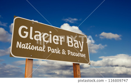Glacier Bay National Park and Preserve (Alaska) Road Sign Against Blue Sky and Clouds. 116809747