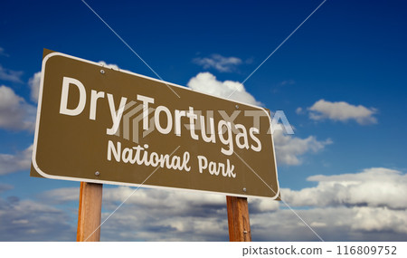 Dry Tortugas National Park (Florida) Road Sign Against Blue Sky and Clouds. Dry Tortugas National Park (Florida) Road Sign Against Blue Sky and Clouds. 116809752