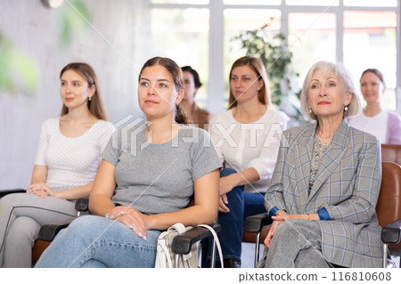 Interested women of different ages listening to master class 116810608
