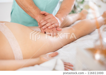 the client lies while the worker gives a massage 116811000