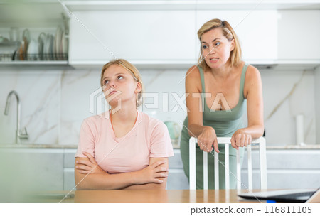 Angry mother yells at teenage girl sad daughter Angry mother yells at teenage girl sad daughter 116811105