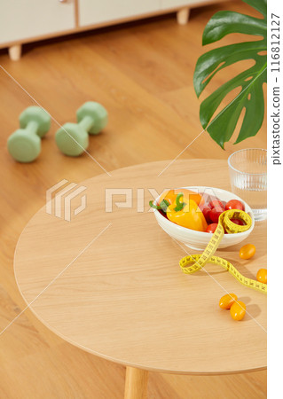 Unique template photo for weight losing products commercial, was taken from above view at the wooden table placed on wooden floor. Blank space for product showing and adding text 116812127