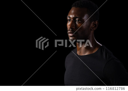 African American man in contemplative pose, with copy space on black background African American man in contemplative pose, with copy space on black background 116812786