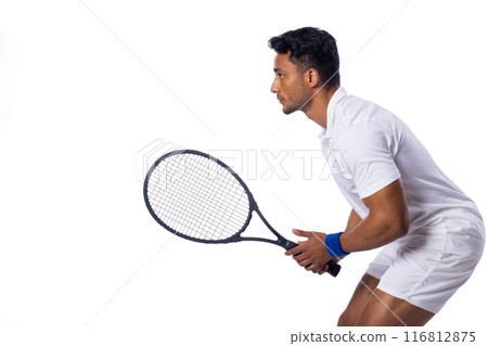 Focused biracial man playing tennis indoors on a white background, with copy space Focused biracial man playing tennis indoors on a white background, with copy space 116812875