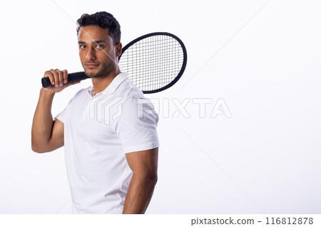 Young biracial man poses with a badminton racket on a white background, with copy space 116812878