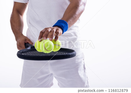 Athlete preparing for a tennis match on white background, with copy space 116812879