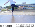 Women playing at the beach 116813812