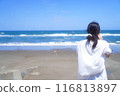A woman looking at the sea and soap bubbles 116813897