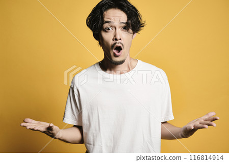 A man posing with a colored bag A man posing with a colored bag 116814914