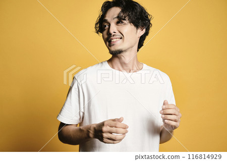 A man posing with a colored bag 116814929