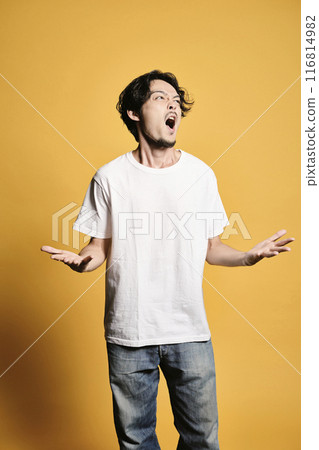 A man posing with a colored bag 116814982