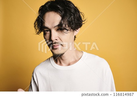 A man posing with a colored bag A man posing with a colored bag 116814987