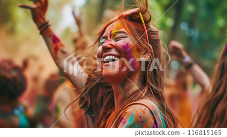 Happy young woman having fun and dancing in crowd at Holi festival of colors, summer party or music festival 116815165