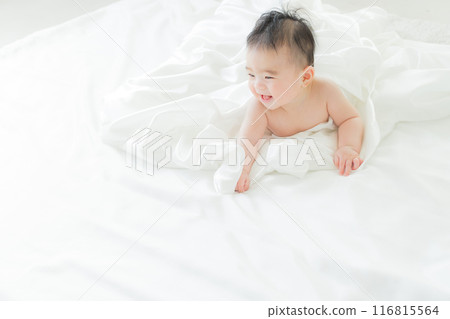 Baby sleeping wrapped in white cloth Baby sleeping wrapped in white cloth 116815564