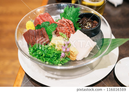 horse meat pieces sashimi or Japanese Basashi. Baniku includes lean meat, superb marbling, mane and liver. Premium meat and famous food in Matsumoto city, Nagano Prefecture, Japan horse meat pieces sashimi or Japanese Basashi. Baniku includes lean meat, superb marbling, mane and liver. Premium meat and famous food in Matsumoto city, Nagano Prefecture, Japan 116816389