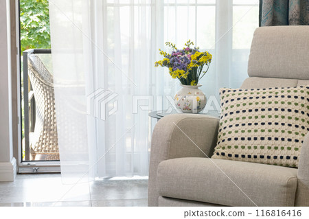 Sliding door in living room with exit to terrace. Modern furniture in Scandinavian style. Interior and design.  116816416