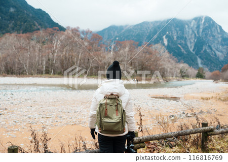Woman tourist travel Kamikochi National Park, happy Traveler sightseeing Azusa river with mountain, Nagano Prefecture, Japan. Landmark for tourists attraction. Japan Travel, Destination and Vacation Woman tourist travel Kamikochi National Park, happy Traveler sightseeing Azusa river with mountain, Nagano Prefecture, Japan. Landmark for tourists attraction. Japan Travel, Destination and Vacation 116816769