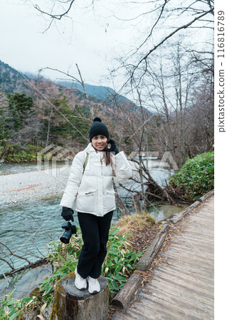 Woman tourist travel Kamikochi National Park, happy Traveler sightseeing Azusa river with mountain, Nagano Prefecture, Japan. Landmark for tourists attraction. Japan Travel, Destination and Vacation Woman tourist travel Kamikochi National Park, happy Traveler sightseeing Azusa river with mountain, Nagano Prefecture, Japan. Landmark for tourists attraction. Japan Travel, Destination and Vacation 116816789