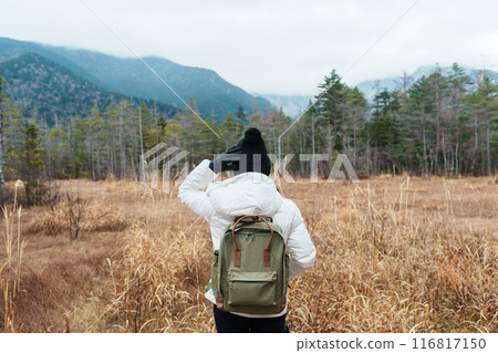 Woman tourist travel Kamikochi National Park, happy Traveler sightseeing meadow fields with mountain, Nagano Prefecture, Japan. Landmark for tourists attraction. Japan Travel, Destination and Vacation 116817150