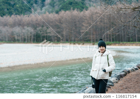 Woman tourist travel Kamikochi National Park, happy Traveler sightseeing Azusa river with mountain, Nagano Prefecture, Japan. Landmark for tourists attraction. Japan Travel, Destination and Vacation 116817154