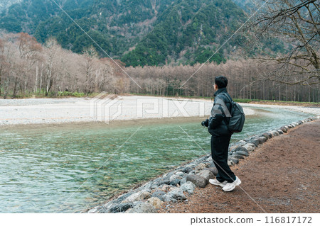 man tourist travel Kamikochi National Park, happy Traveler sightseeing Azusa river with mountain, Nagano Prefecture, Japan. Landmark for tourists attraction. Japan Travel, Destination and Vacation man tourist travel Kamikochi National Park, happy Traveler sightseeing Azusa river with mountain, Nagano Prefecture, Japan. Landmark for tourists attraction. Japan Travel, Destination and Vacation 116817172