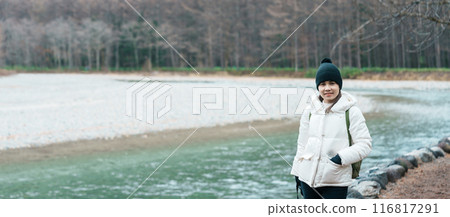 Woman tourist travel Kamikochi National Park, happy Traveler sightseeing Azusa river with mountain, Nagano Prefecture, Japan. Landmark for tourists attraction. Japan Travel, Destination and Vacation 116817291