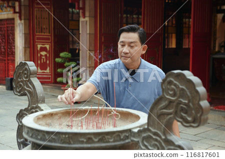 Man Praying In Buddhism Temple Man Praying In Buddhism Temple 116817601
