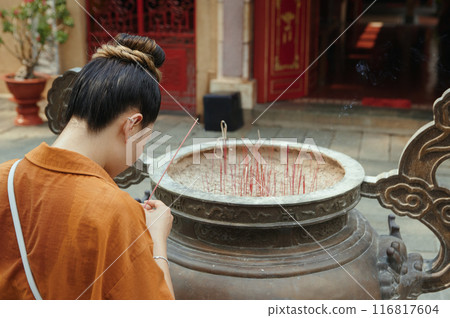 Woman Praying Outdoors In Temple Woman Praying Outdoors In Temple 116817604