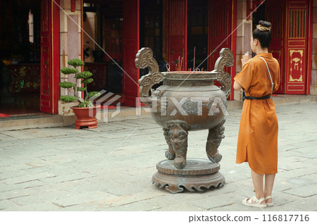 Woman Standing Near Ancient Grail And Praying 116817716