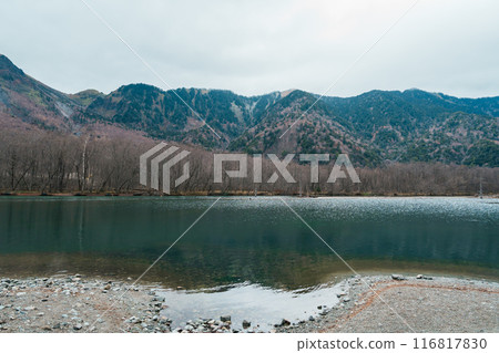 Kamikochi National Park, Taisho pond with Alps mountain, Nagano Prefecture, Japan. Landmark for tourists attraction. Japan Travel, Destination and Vacation concept 116817830