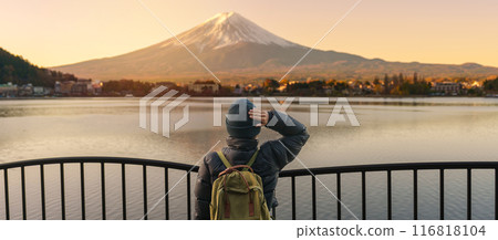 Woman tourist with Fuji Mountain at Lake Kawaguchi, happy Traveler sightseeing Mount Fuji in Fujikawaguchiko, Yamanashi, Japan. Landmark for tourists attraction. Japan Travel, Destination and Vacation 116818104