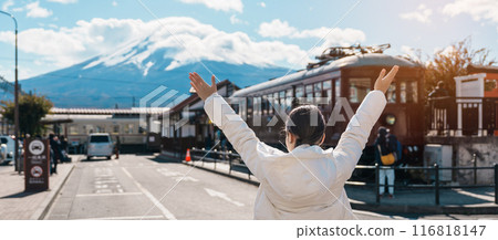 Woman tourist with Fuji Mountain at Kawaguchiko train station, happy Traveler sightseeing Mount Fuji in Yamanashi, Japan. Landmark for tourists attraction. Japan Travel, Destination and Vacation Woman tourist with Fuji Mountain at Kawaguchiko train station, happy Traveler sightseeing Mount Fuji in Yamanashi, Japan. Landmark for tourists attraction. Japan Travel, Destination and Vacation 116818147