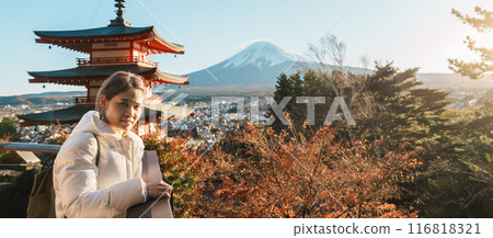 Woman tourist with mount Fuji at Chureito Pagoda in Autumn season, Traveler travel Arakurayama Sengen Park, Yamanashi, Japan. Landmark for tourist attraction. Japan Travel, Destination and Vacation Woman tourist with mount Fuji at Chureito Pagoda in Autumn season, Traveler travel Arakurayama Sengen Park, Yamanashi, Japan. Landmark for tourist attraction. Japan Travel, Destination and Vacation 116818321