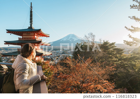 Woman tourist with mount Fuji at Chureito Pagoda in Autumn season, Traveler travel Arakurayama Sengen Park, Yamanashi, Japan. Landmark for tourist attraction. Japan Travel, Destination and Vacation Woman tourist with mount Fuji at Chureito Pagoda in Autumn season, Traveler travel Arakurayama Sengen Park, Yamanashi, Japan. Landmark for tourist attraction. Japan Travel, Destination and Vacation 116818323