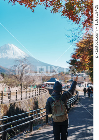 Woman tourist with mount Fuji at Saiko Iyashino Sato Nenba in Autumn season, happy Traveler travel Mt Fuji, Yamanashi, Japan. Landmark for tourist attraction. Japan Travel, Destination and Vacation Woman tourist with mount Fuji at Saiko Iyashino Sato Nenba in Autumn season, happy Traveler travel Mt Fuji, Yamanashi, Japan. Landmark for tourist attraction. Japan Travel, Destination and Vacation 116818429
