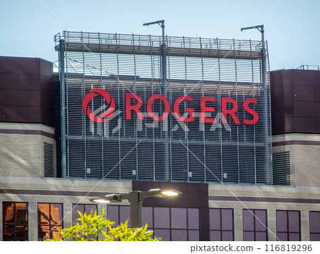 Calgary, Alberta, Canada. Jul 04, 2024. A close up to a Rogers building sign in Calgary. 116819296