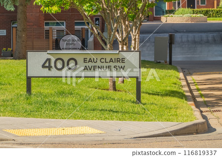 Calgary, Alberta, Canada. Jul 04, 2024. An Eau Claire sign, a neighbourhood in Calgary located immediately north of Downtown. 116819337