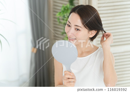 Beauty image of a young woman doing hair care Beauty image of a young woman doing hair care 116819392