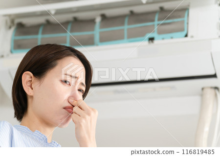 Young woman who is concerned about the smell of the air conditioner Lifestyle image 116819485