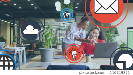 Image of icon in circles over diverse female coworkers discussing reports on laptop in office 116819851