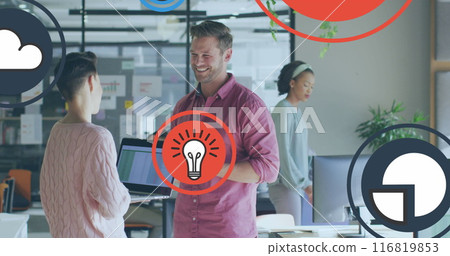 Image of icon in circles over diverse coworkers standing and discussing in office Image of icon in circles over diverse coworkers standing and discussing in office 116819853