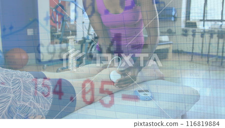 Image of trading board over diverse woman using equipment and giving leg massage to woman Image of trading board over diverse woman using equipment and giving leg massage to woman 116819884
