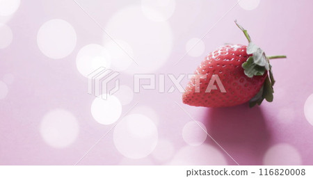 Composition of strawberry and white spots on pink background Composition of strawberry and white spots on pink background 116820008
