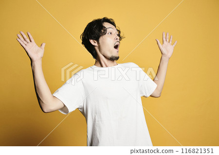 A man posing with a colored bag A man posing with a colored bag 116821351