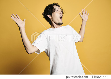 A man posing with a colored bag 116821352