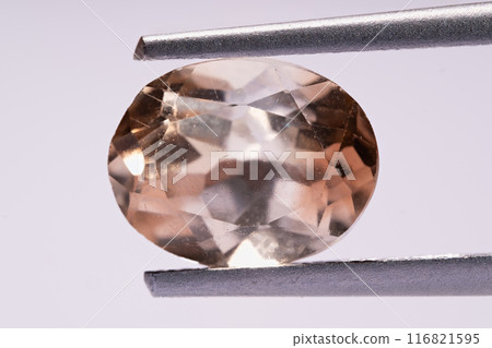 natural imperial yellow topaz gem on isolated white background 116821595