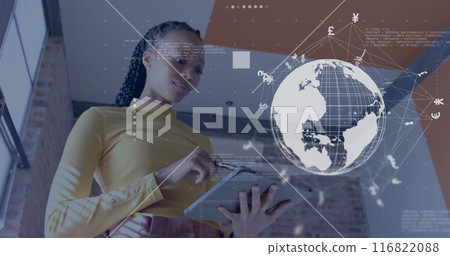 Image of globe with network and currency signs over african american woman using tablet 116822088