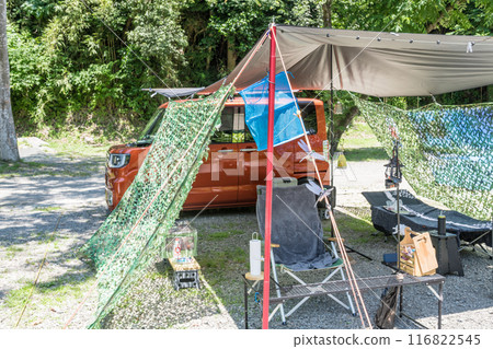 [Auto camping site: Tarp set up in the woods, hanging net] 116822545
